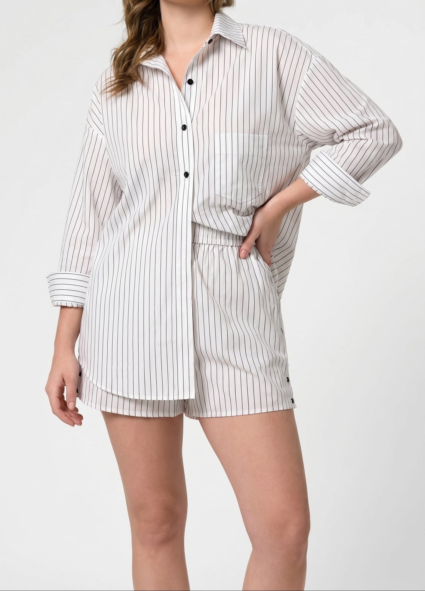 Model wearing the ROEM Jettie Short in Black and White Stripe, styled with the Cooper Top, front view