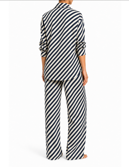 Model wearing the ROEM Anse Pant in Indigo, styled with the Gallion Top, back view