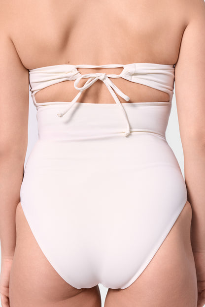 Close-up of the back-tie detail on the ROEM Bartolome Bandeau Top One Piece in Pearl