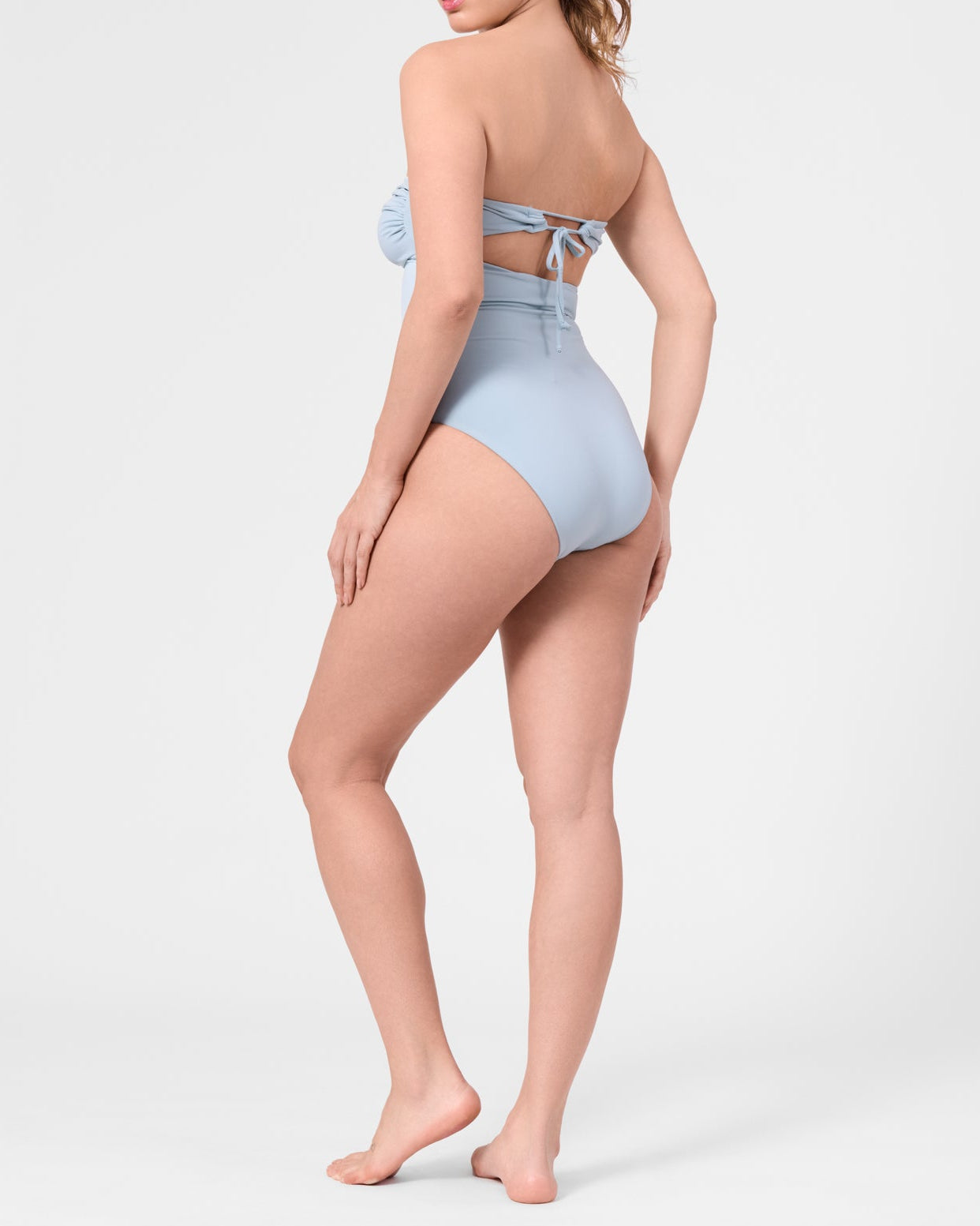 Model wearing the ROEM Bartolome Bandeau Top One Piece in Pool, back view