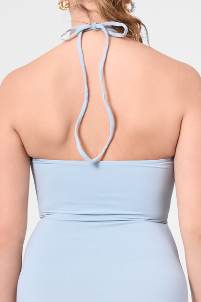 Detail shot of the ROEM Bartolome Twist Top Dress in Pool, halter tie detail