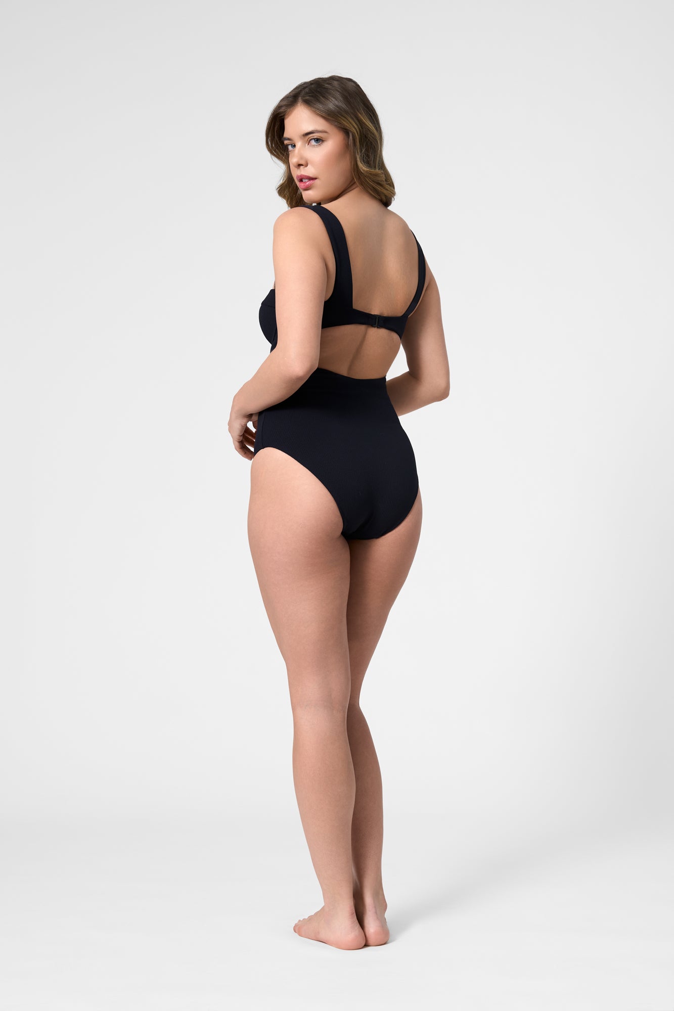Model wearing the ROEM Calabria One Piece in Black, back view