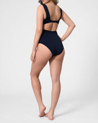 Model wearing the ROEM Calabria One Piece in Indigo, back view