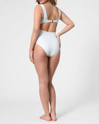 Model wearing the ROEM Calabria One Piece in Pearl, back view