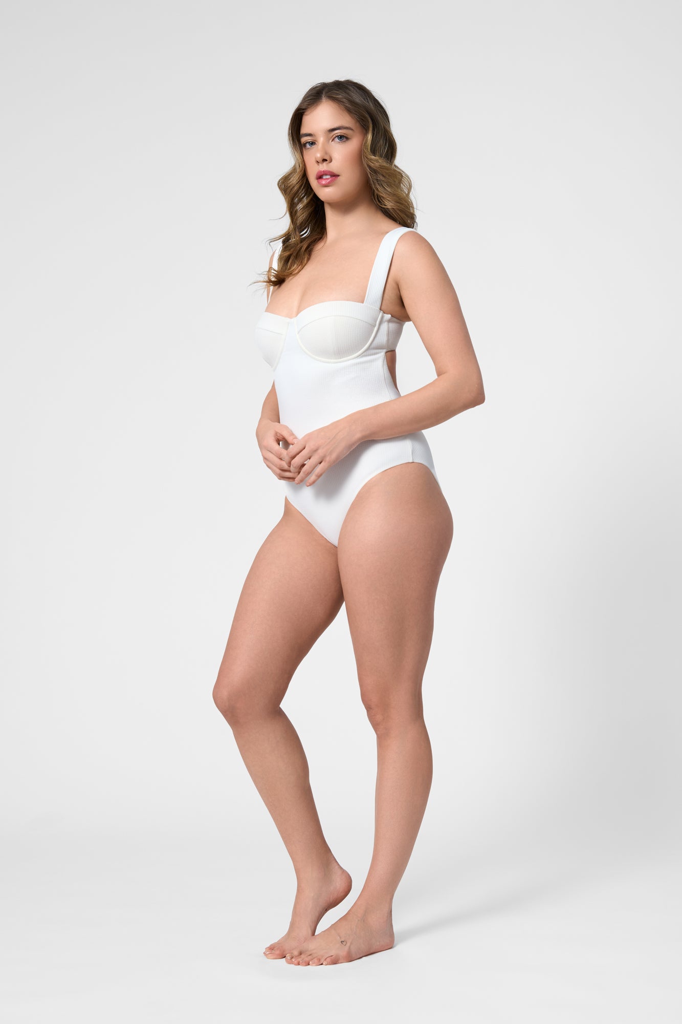 Model wearing the ROEM Calabria One Piece in Pearl, side view