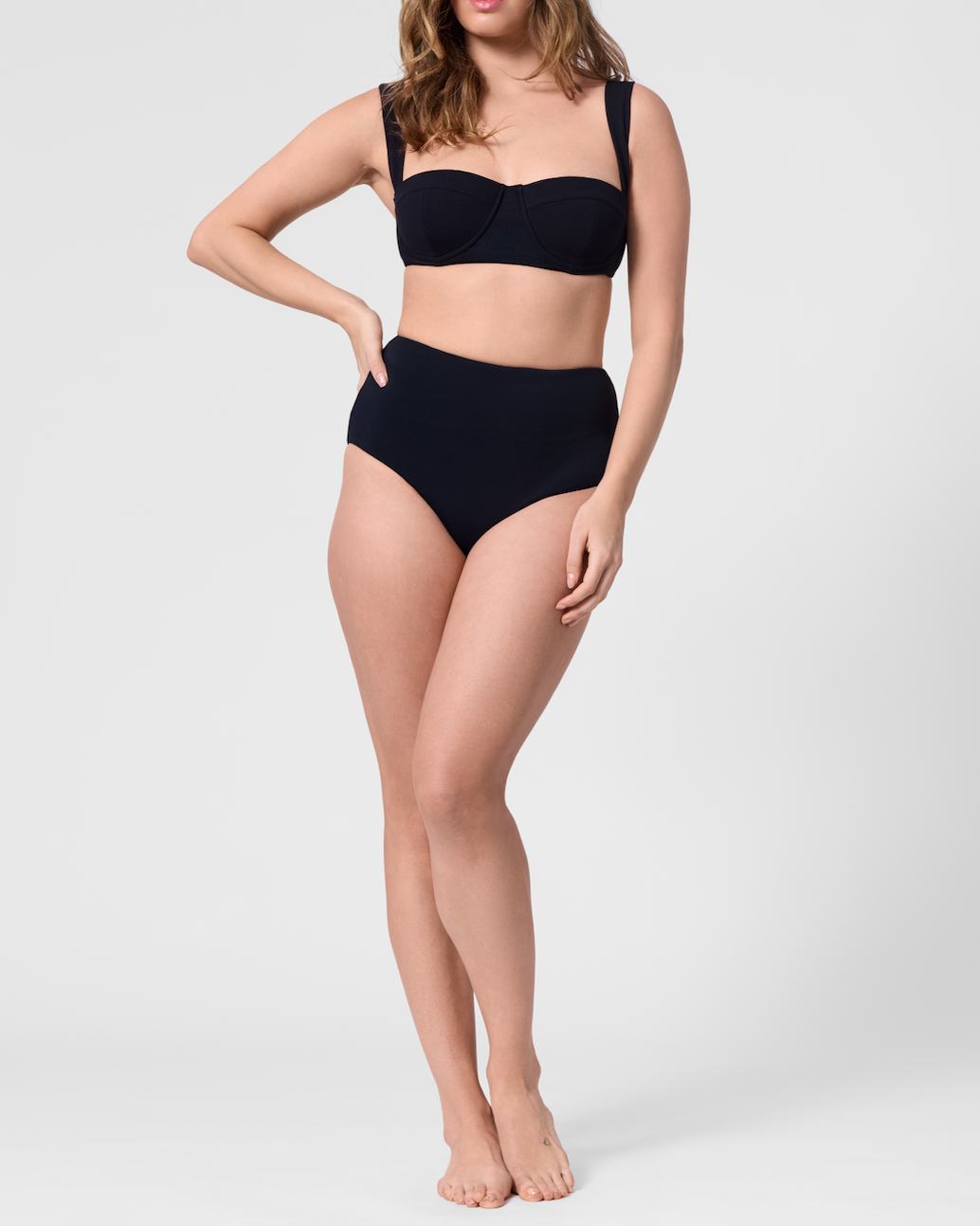 Model wearing the ROEM Calabria Top in Black, front view