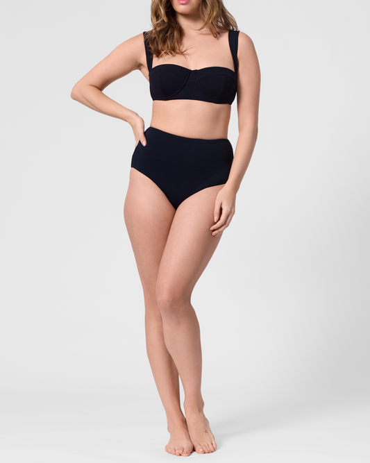 Model wearing the ROEM Calabria Top in Black, front view