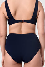 Model wearing the ROEM Calabria Top in Indigo, close-up back view