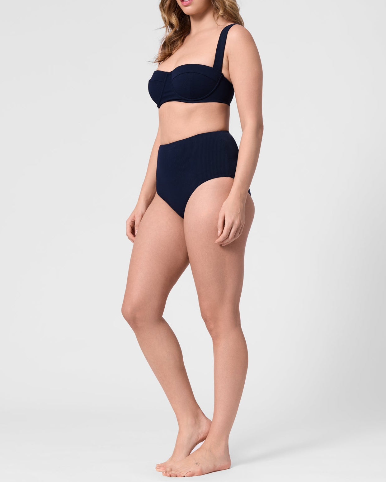 Model wearing the ROEM Calabria Top in Indigo, side view