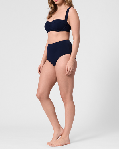 Model wearing the ROEM Calabria Top and Lana Texture Bottom in Indigo, side view