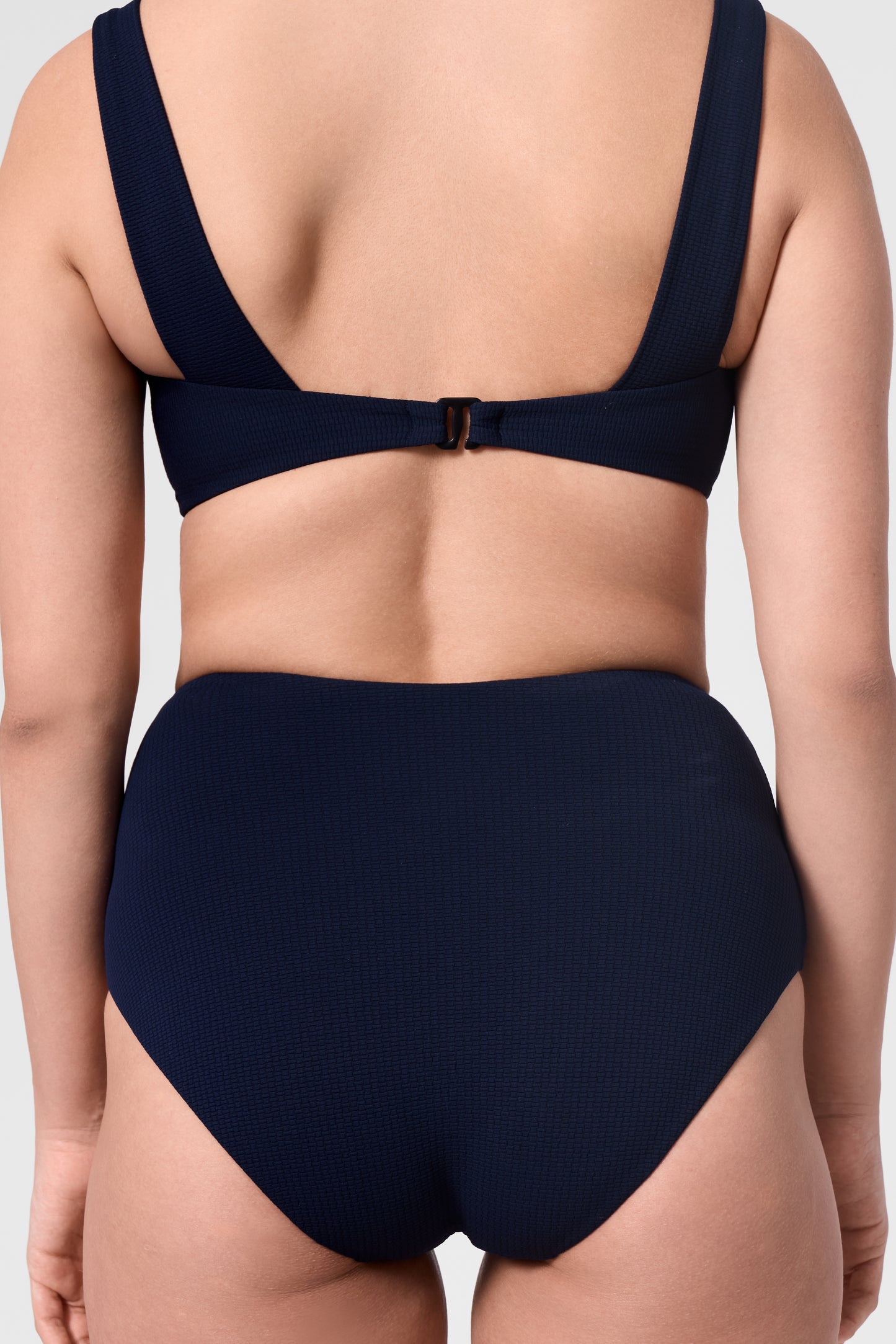 Close-up of the ROEM Calabria Top and Lana Texture Bottom in Indigo, back detail