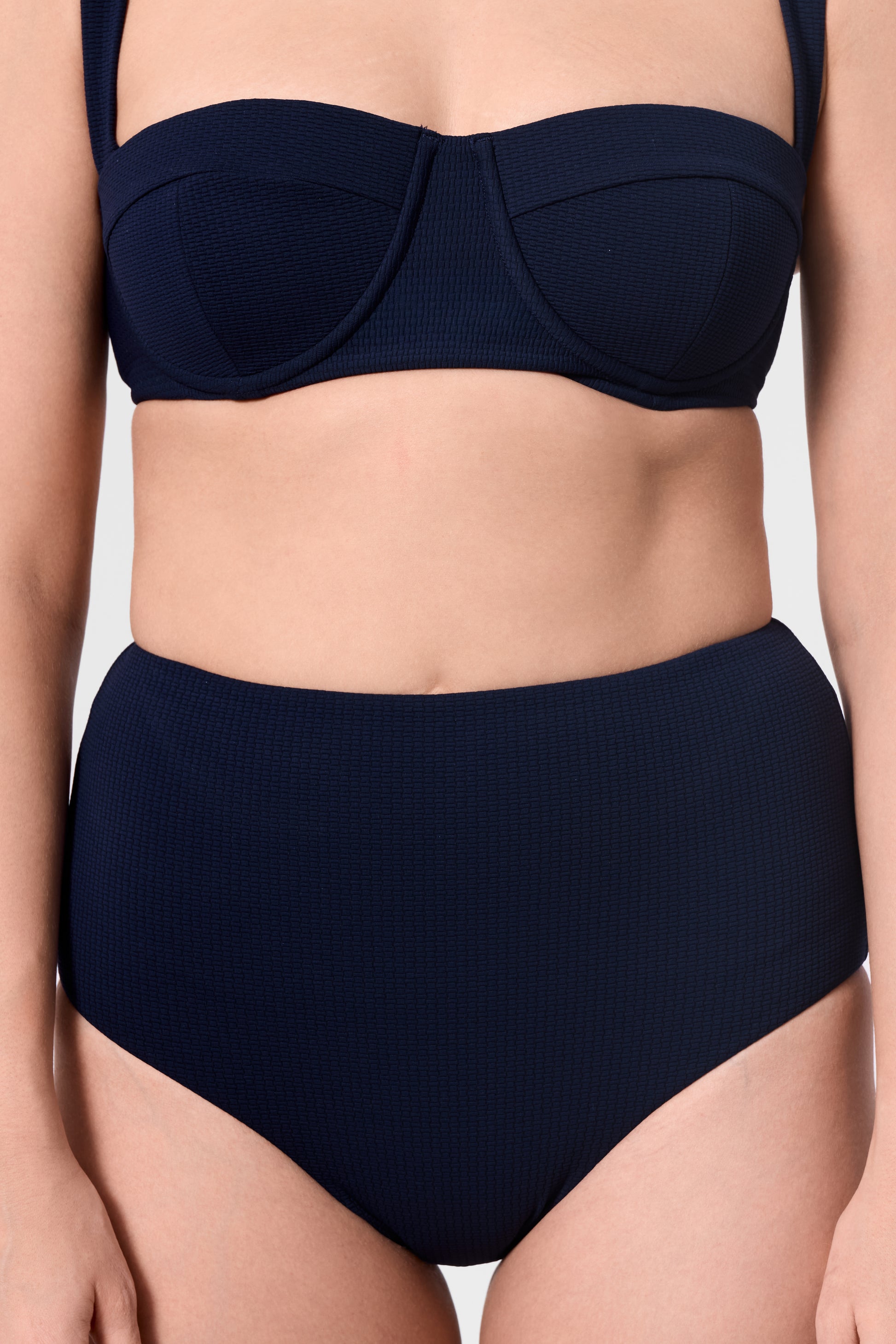 Close-up of the ROEM Calabria Top and Lana Texture Bottom in Indigo, front detail