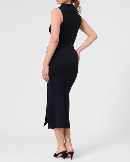 Model wearing the ROEM Grace Swim Top in Black, styled with the Itaso Skirt, back view