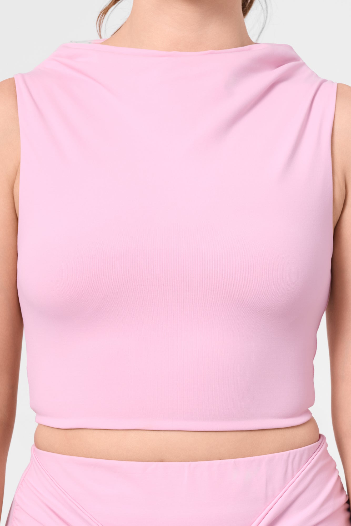 Detail shot of the ROEM Grace Swim Top in Bloom, fabric and neckline detail