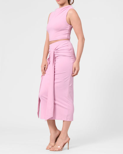 Model wearing the ROEM Itaso Front Wrap Skirt in Bloom, styled with the Grace Top, side view
