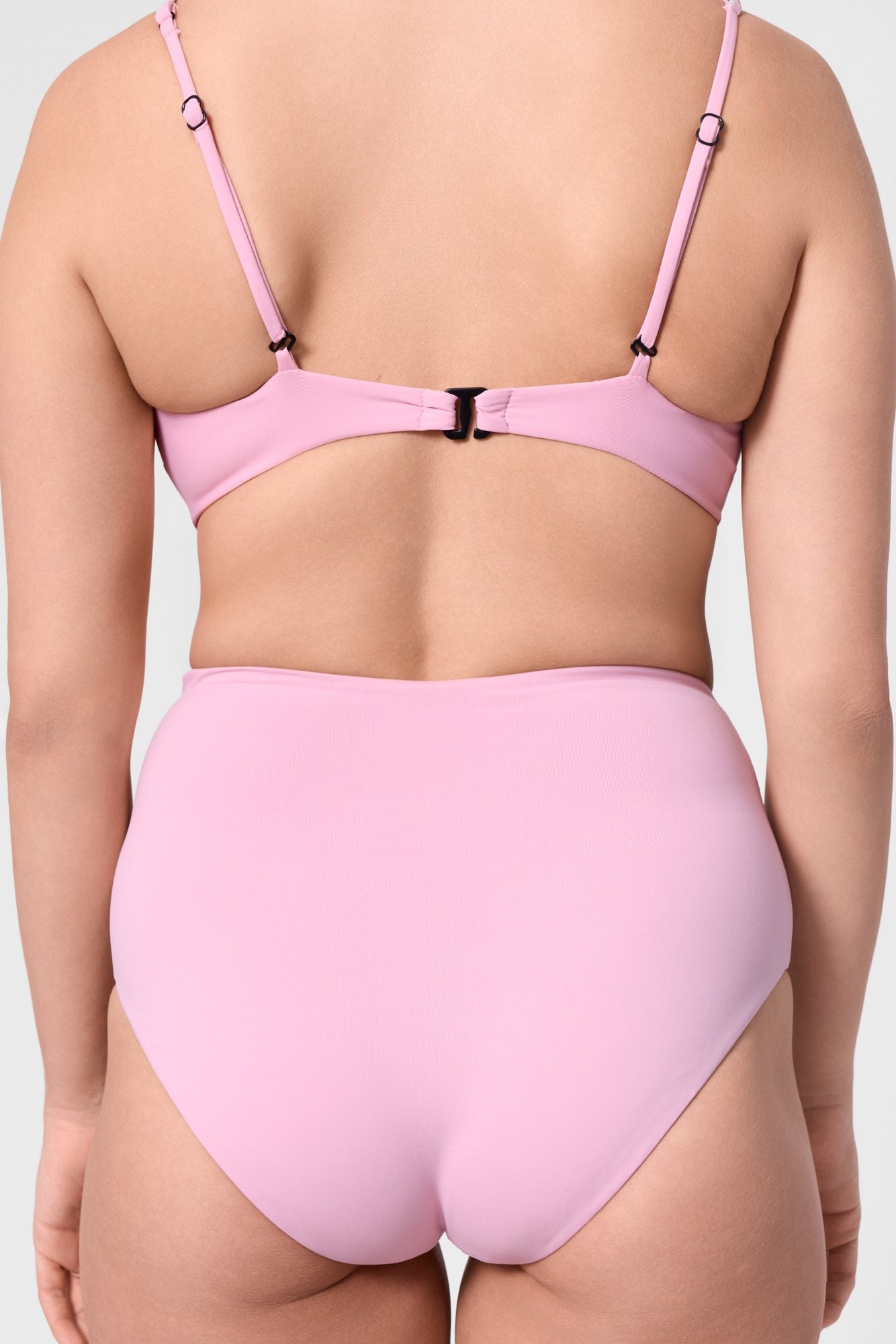 Model wearing the ROEM Lana Bottom in Bloom, back detail view