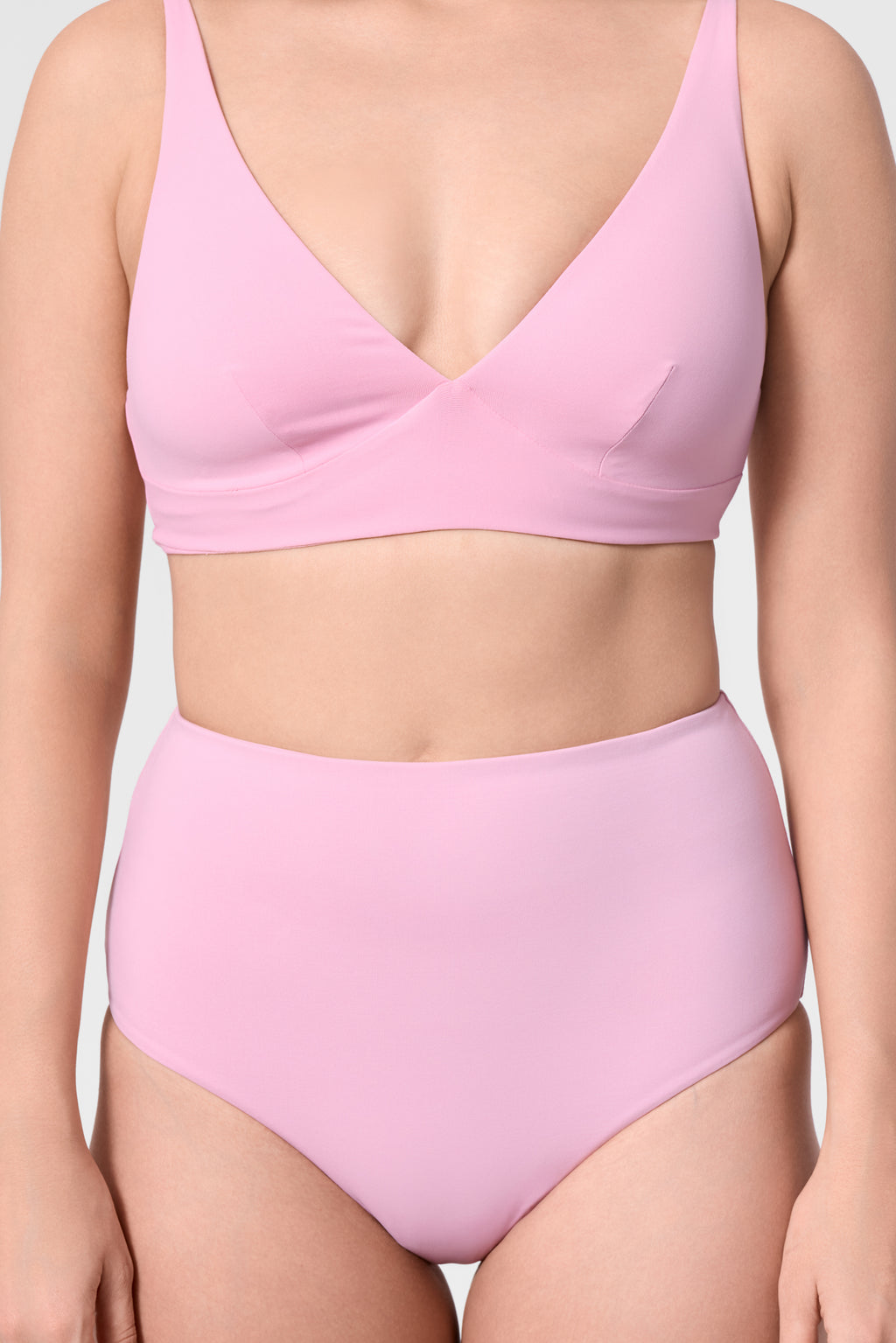 Model wearing the ROEM Lana Bottom in Bloom, front detail view