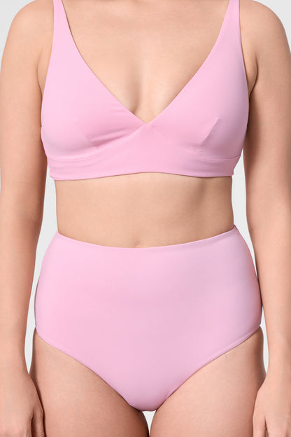 Model wearing the ROEM Lana Bottom in Bloom, front detail view