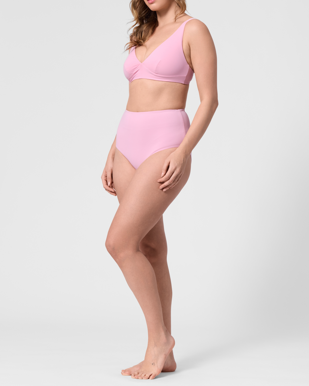 Model wearing the ROEM Lana Bottom in Bloom, side view