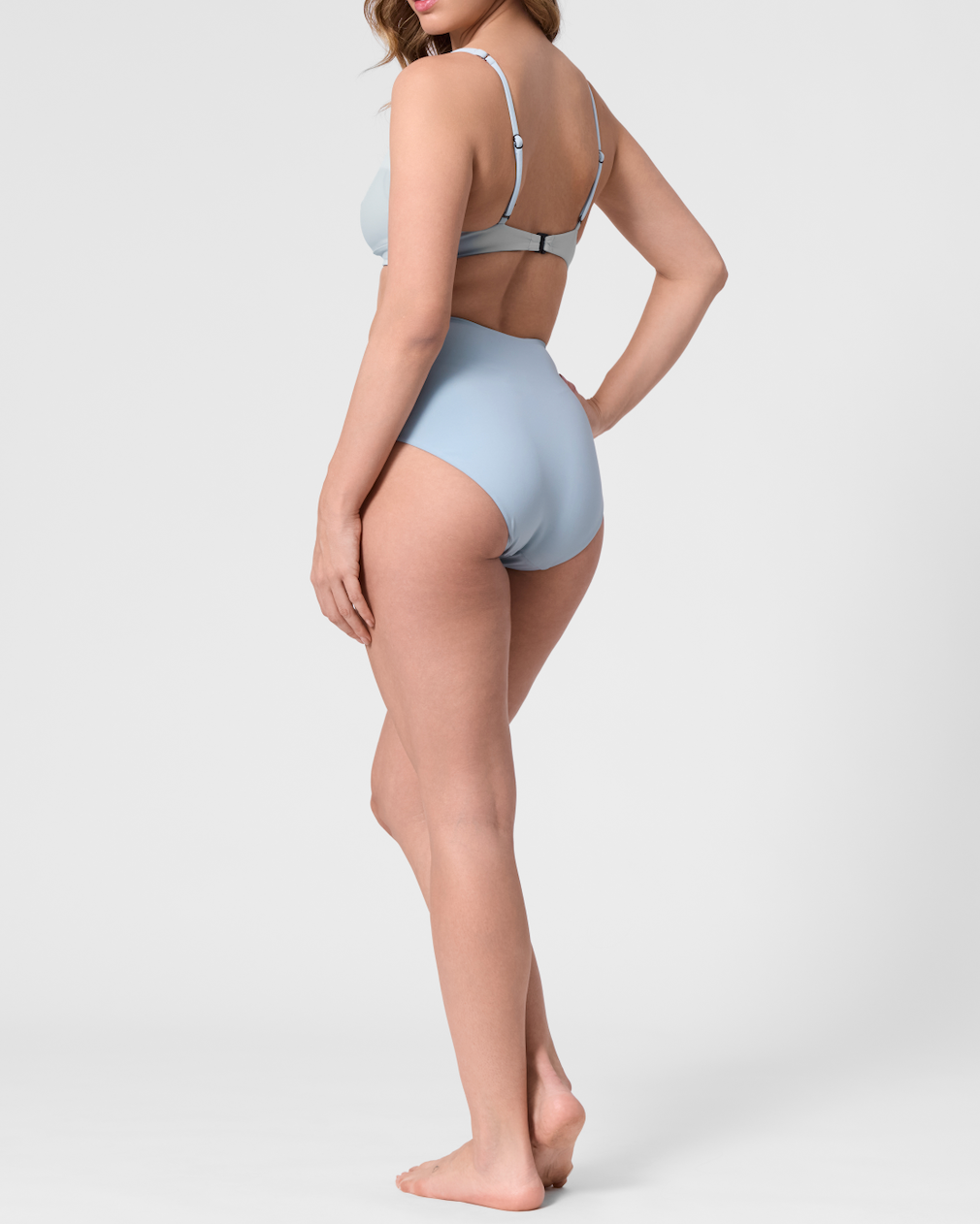 Model wearing the ROEM Lana Bottom  in Pool, back view