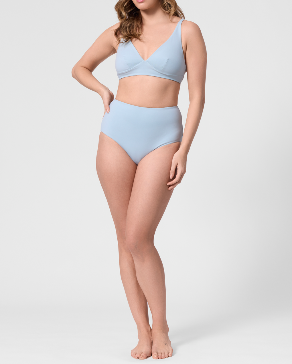 Model wearing the ROEM Lana Bottom in Pool, front view