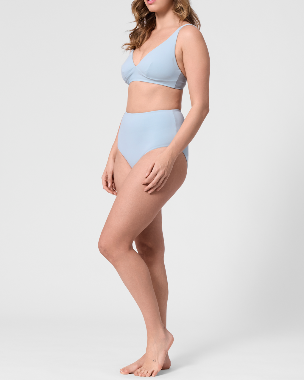 Model wearing the ROEM Lana Bottom in Pool, side view