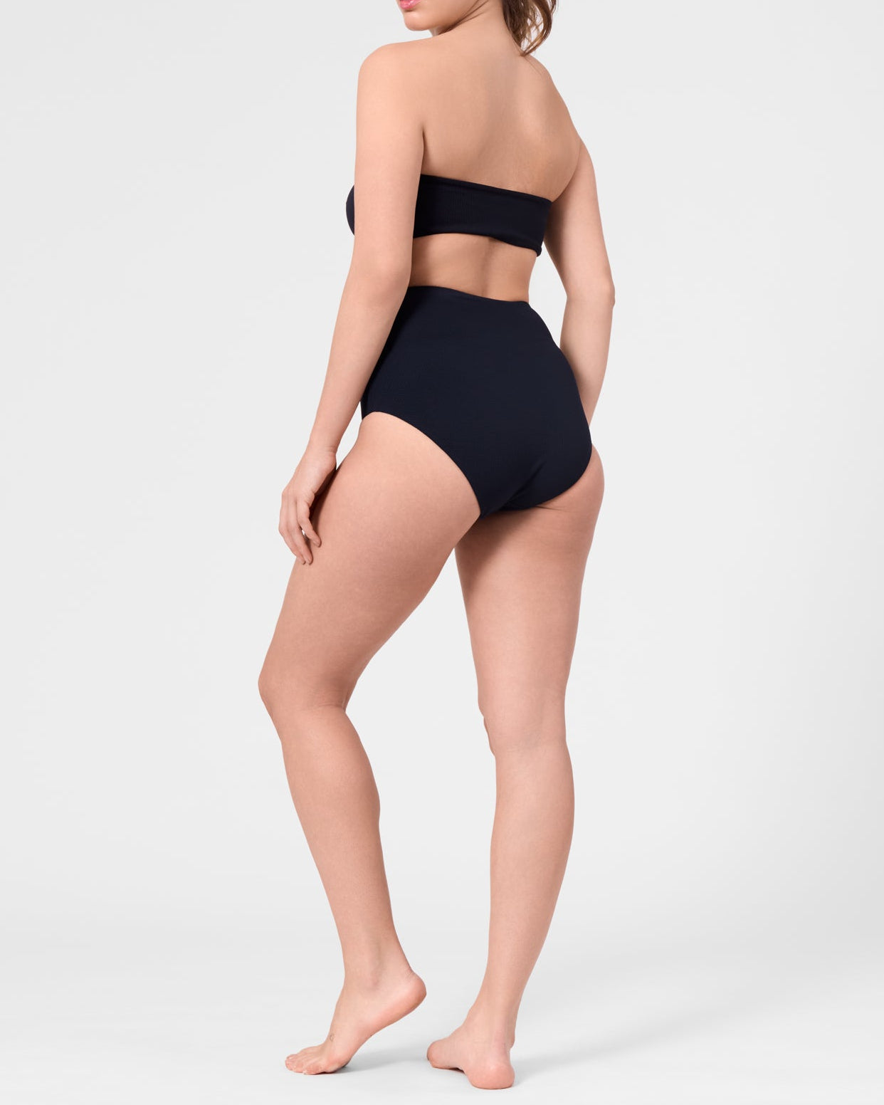 Model wearing the ROEM Marigot V High Rise Bottom in Black, alternate back view