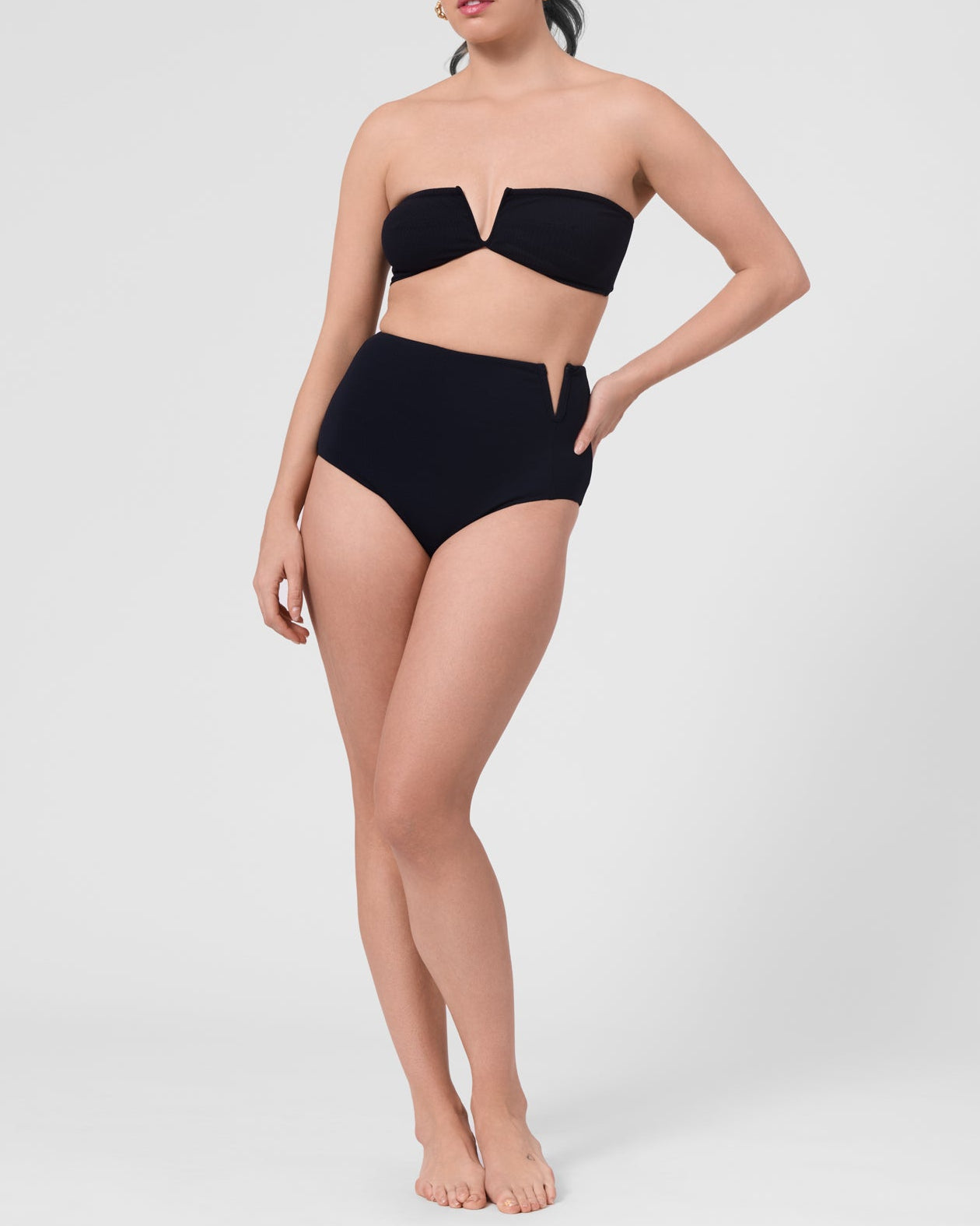 Model wearing the ROEM Marigot V High Rise Bottom in Black, front view