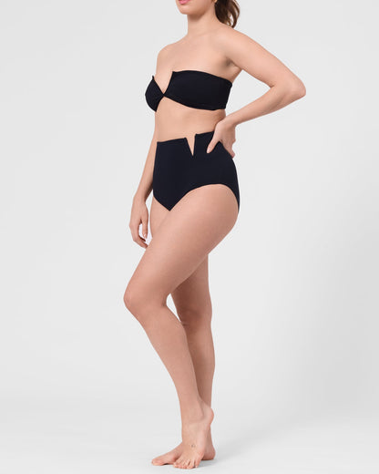 Model wearing the ROEM Marigot V High Rise Bottom in Black, side view