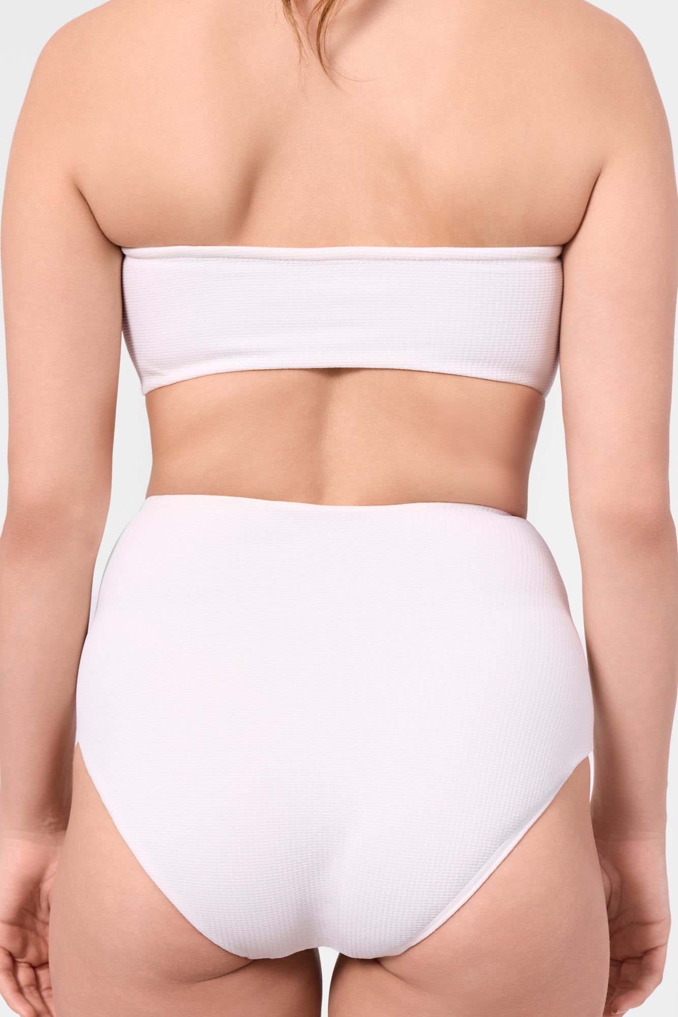 Model wearing the ROEM Marigot V High Rise Bottom in Pearl, back detail view