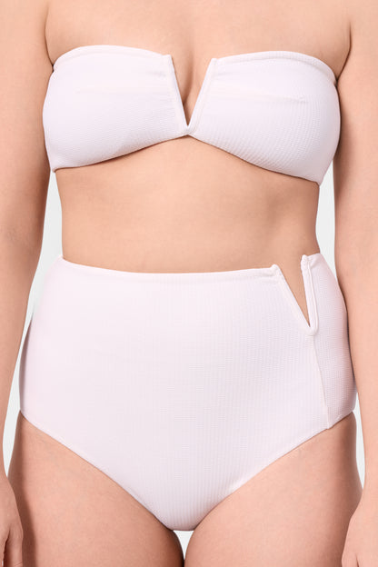 Model wearing the ROEM Marigot V High Rise Bottom in Pearl, front detail view
