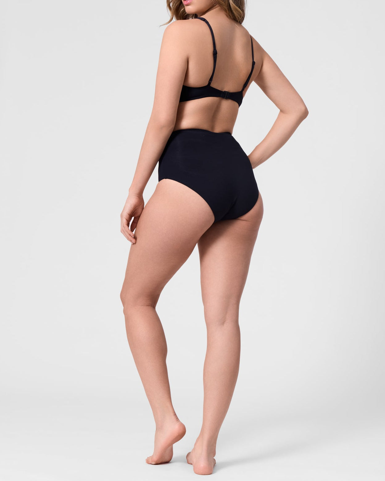 Model wearing the ROEM Lana Bottom in Black, back view