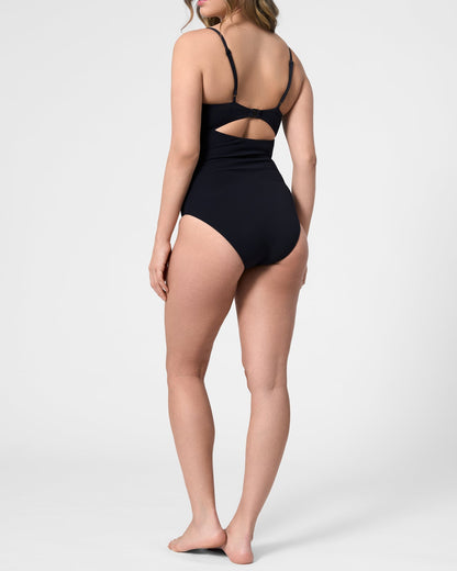 Model wearing the ROEM Santa Cruz One Piece in Black, back view