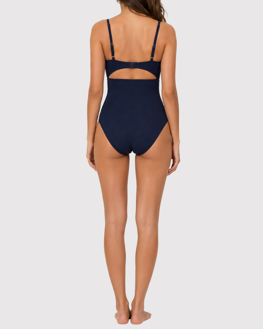 Model wearing the ROEM Santa Cruz One Piece in Indigo, back view