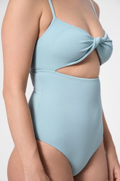 Detail shot of the ROEM Santa Cruz One Piece in Pool, twist-front bust detail