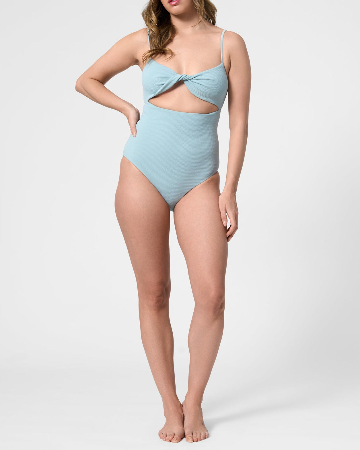 Model wearing the ROEM Santa Cruz One Piece in Pool, front view